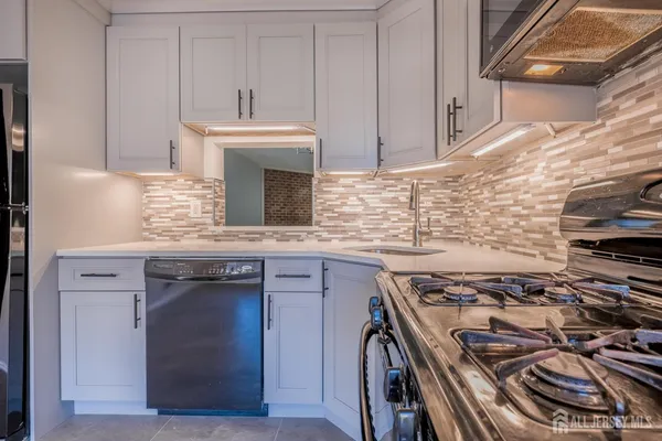 a kitchen with a stove and a sink