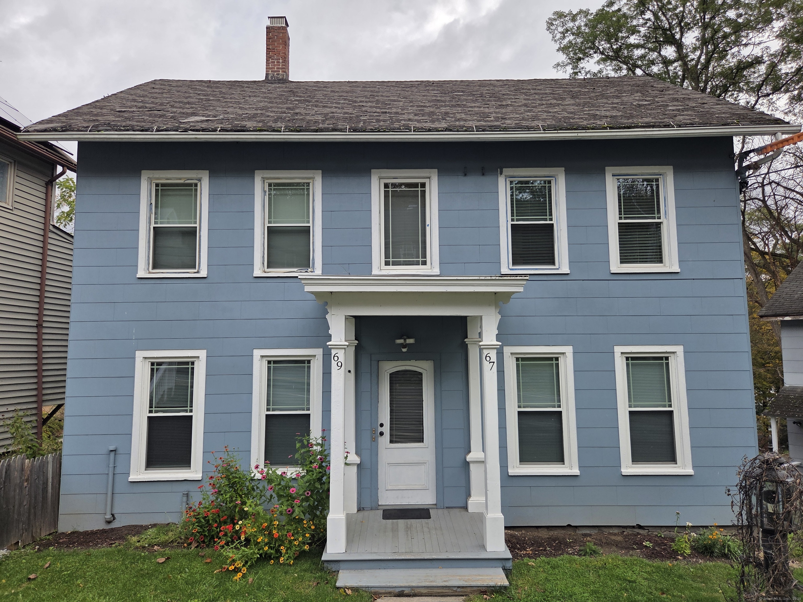 67 Torrington Avenue Canton, CT 06019 - Photo 1 of 1 a front view of a house with garden
