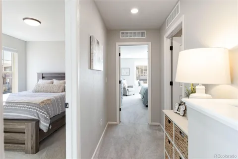 a room that has a bed and a view of bedroom