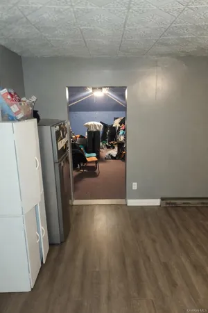a view of a livingroom with furniture and a garage
