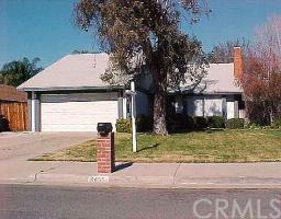 8455 Williamsburg Place Riverside, CA 92504 - Photo 1 of 1 a front view of a house with garden