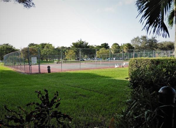 16200 Golf Club Road, Unit 312 Weston, FL 33326 - Photo 19 of 31 a view of outdoor space with garden and deck