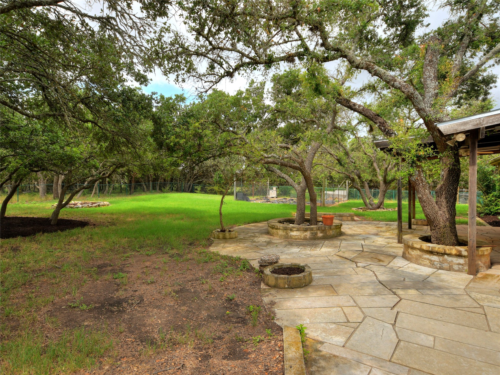 328 Fawnridge Street Georgetown, TX 78628 - Photo 29 of 33 Fully fenced backyard with garden and patios.