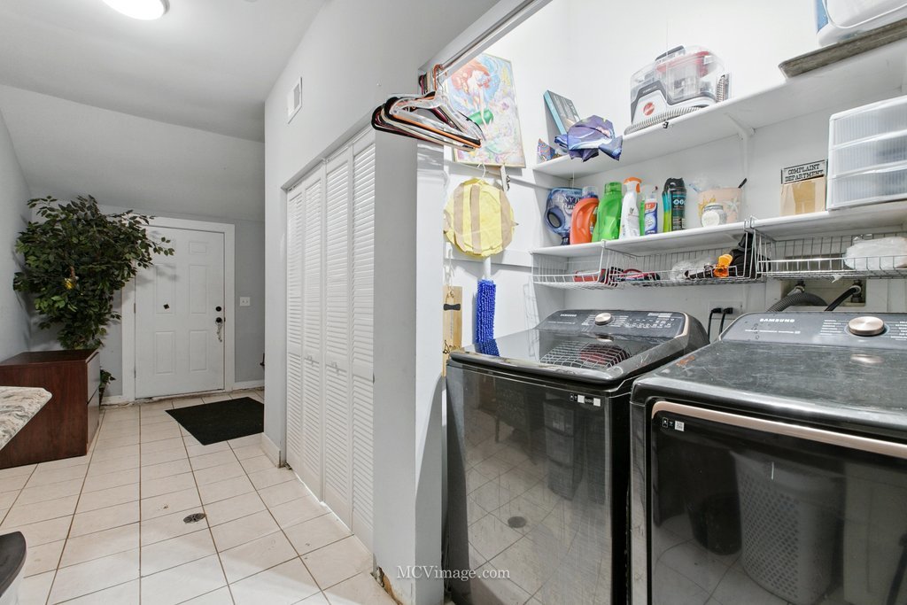 15514 Ridgeway Avenue Markham, IL 60428 - Photo 11 of 15 a kitchen with stainless steel appliances granite countertop a sink a stove and a refrigerator