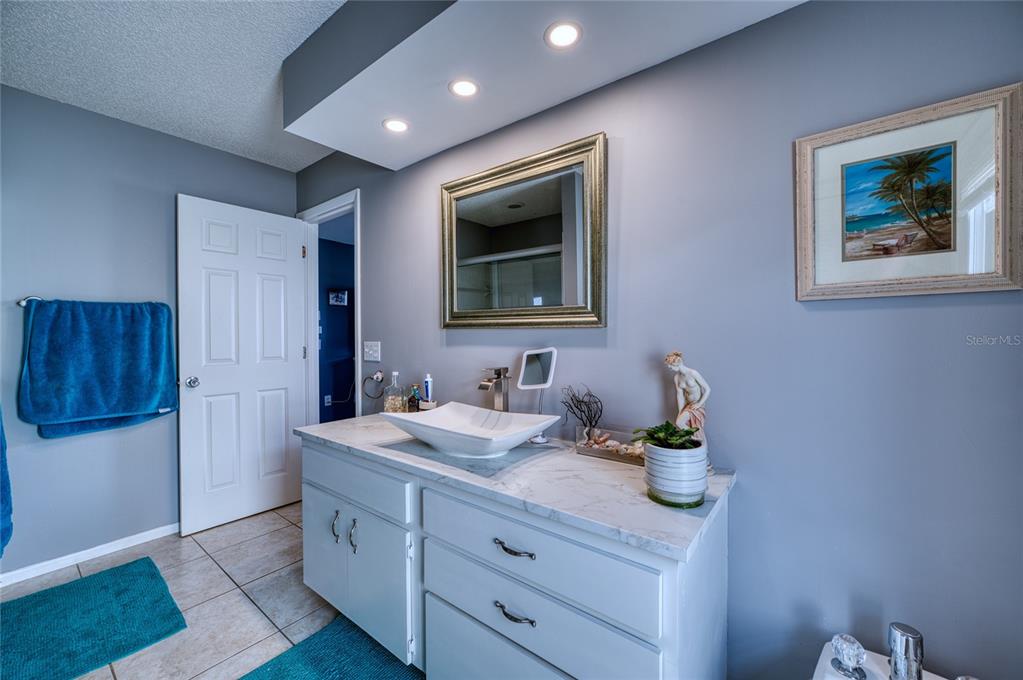 76 Sandstone Circle Venice, FL 34293 - Photo 11 of 37 a bathroom with a sink a vanity and a mirror