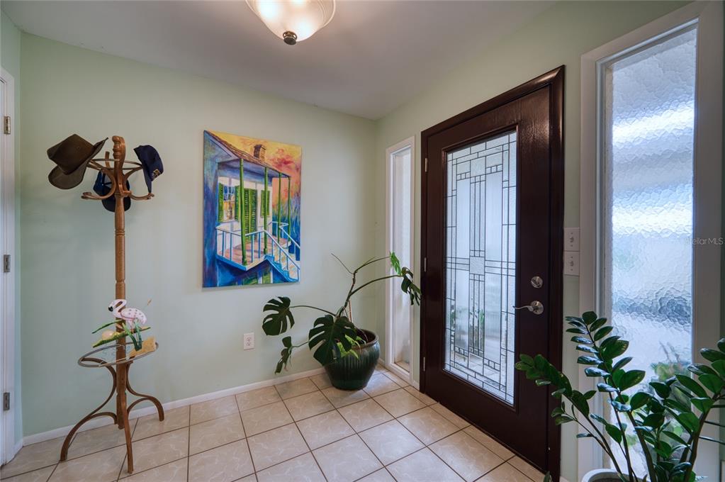 76 Sandstone Circle Venice, FL 34293 - Photo 2 of 37 a view of hallway with potted plant in front of a house