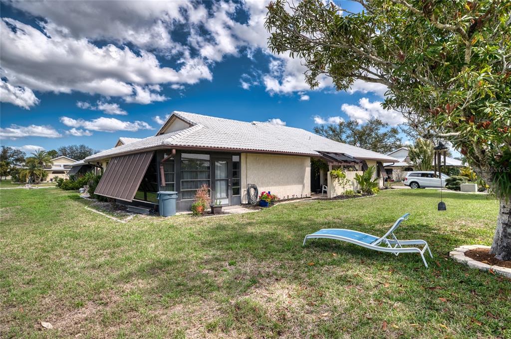 76 Sandstone Circle Venice, FL 34293 - Photo 22 of 37 a view of a house with a yard and sitting area