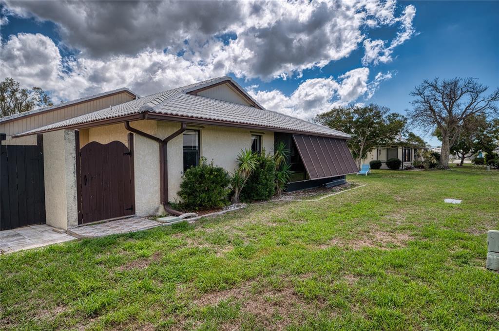 76 Sandstone Circle Venice, FL 34293 - Photo 23 of 37 a view of a house with a back yard