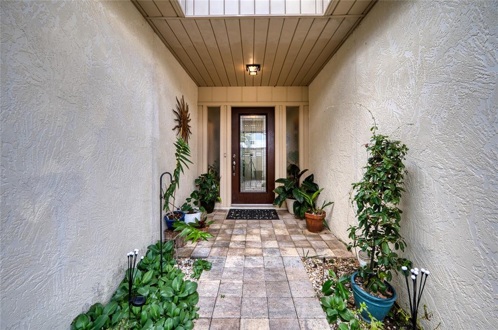 76 Sandstone Circle Venice, FL 34293 - Photo 26 of 37 a front view of a house with potted plants