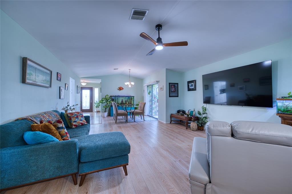 76 Sandstone Circle Venice, FL 34293 - Photo 3 of 37 a living room with furniture and a flat screen tv
