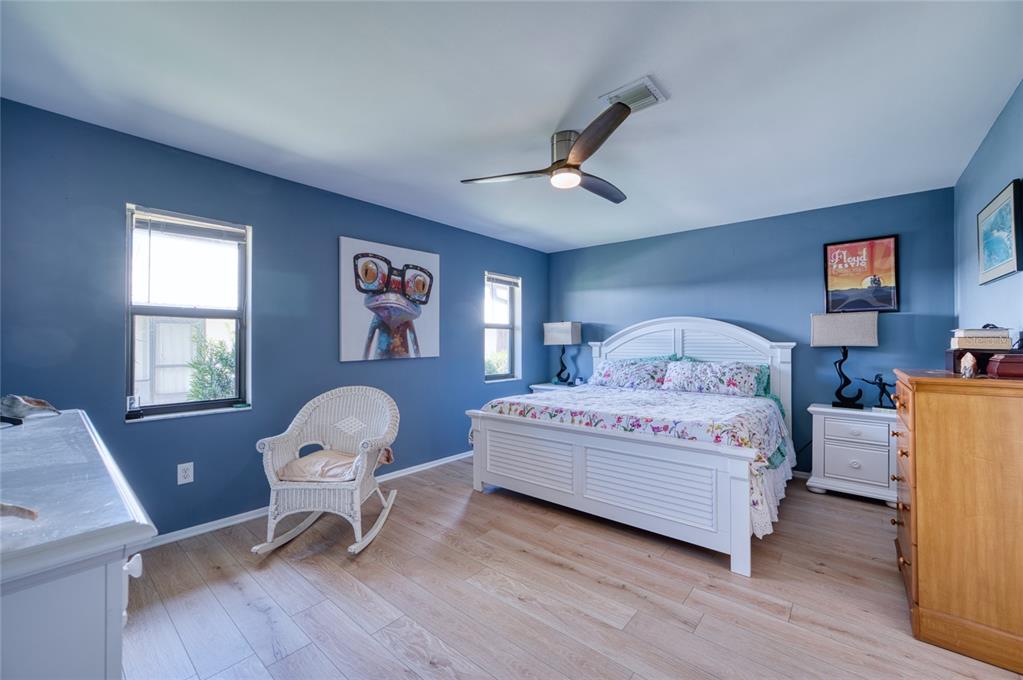 76 Sandstone Circle Venice, FL 34293 - Photo 8 of 37 a bedroom with a bed chair and a window