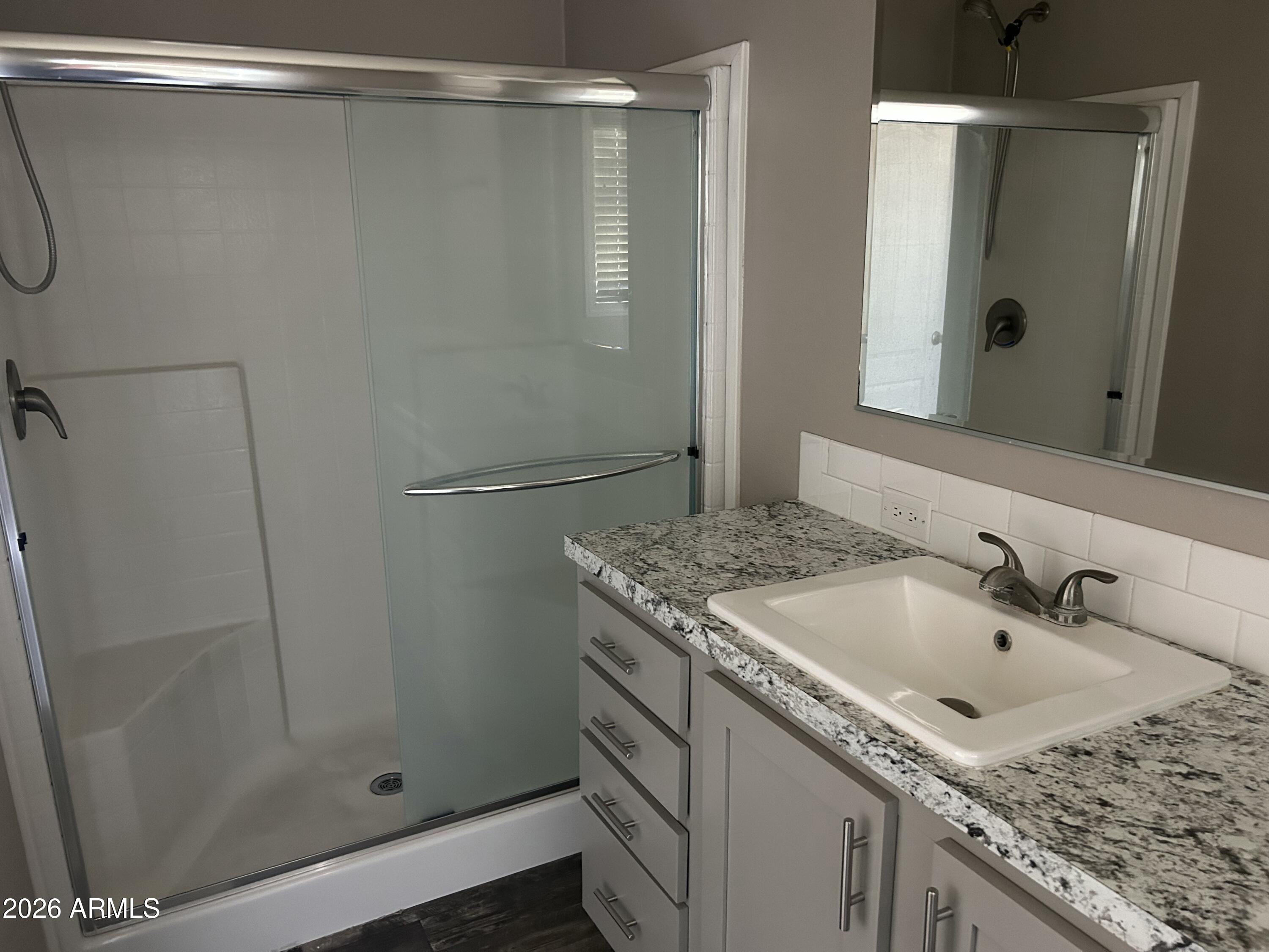 1067 Thorton Road Camp Verde, AZ 86322 - Photo 16 of 21 a bathroom with a granite countertop sink and shower