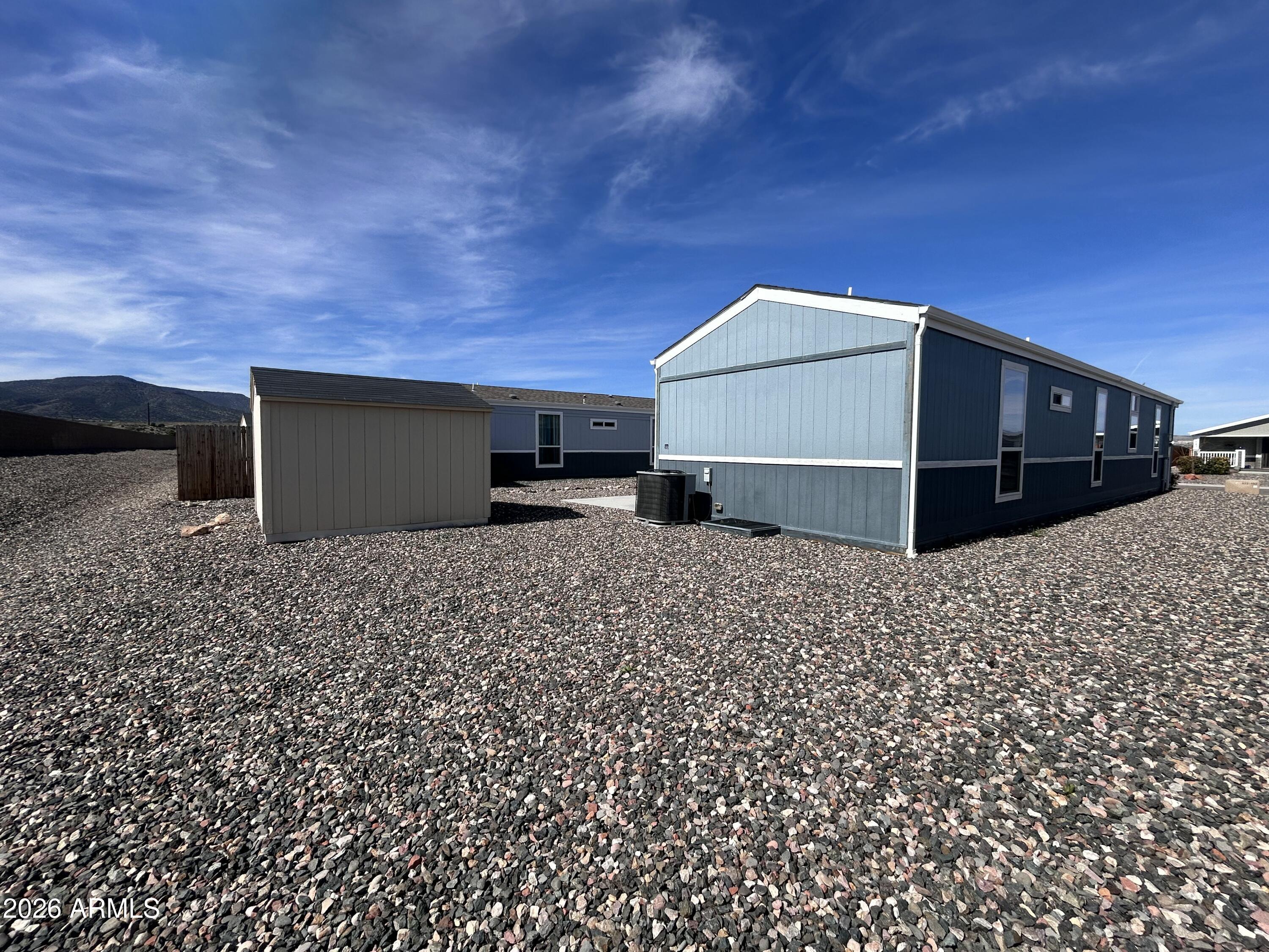 1067 Thorton Road Camp Verde, AZ 86322 - Photo 17 of 21 a front view of a house with a yard