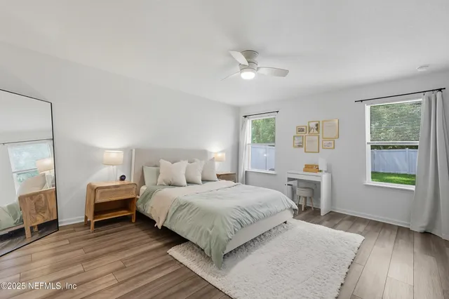 a bedroom with a large bed and a window