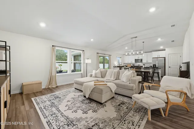a living room with furniture and a rug