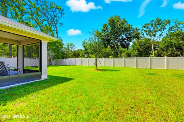 a view of swimming pool with a backyard