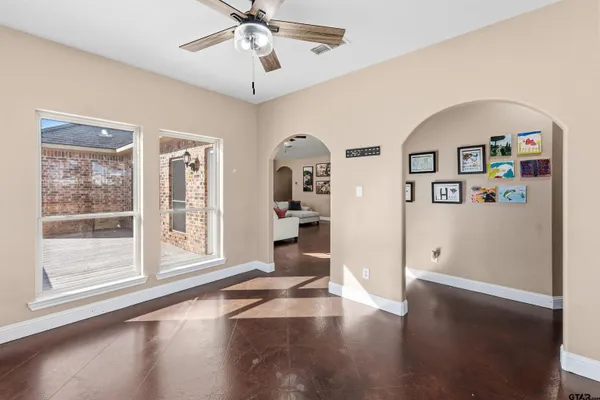 a bedroom with furniture and wooden floor