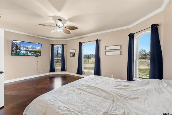 a bedroom with a bed and a desk