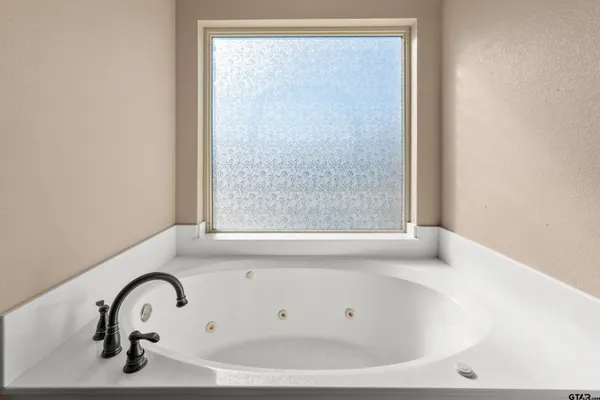 a utility room with faucet washer and dryer
