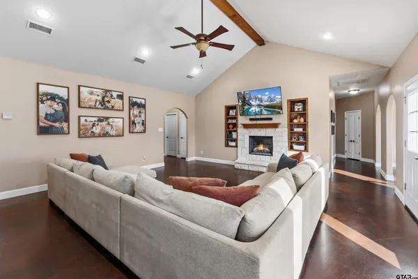 a living room with furniture and a fireplace