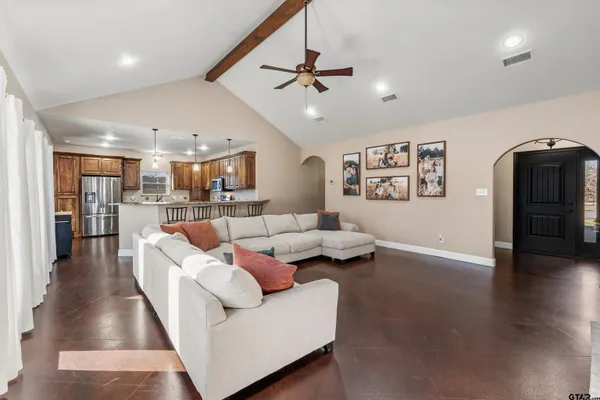 a view of a hallway with workspace and mirror