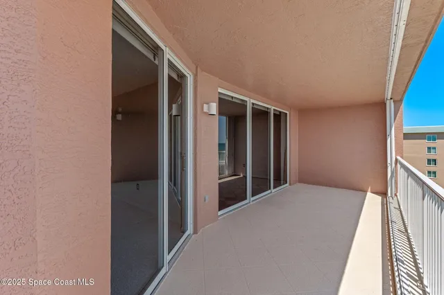 a view of swimming pool from a balcony