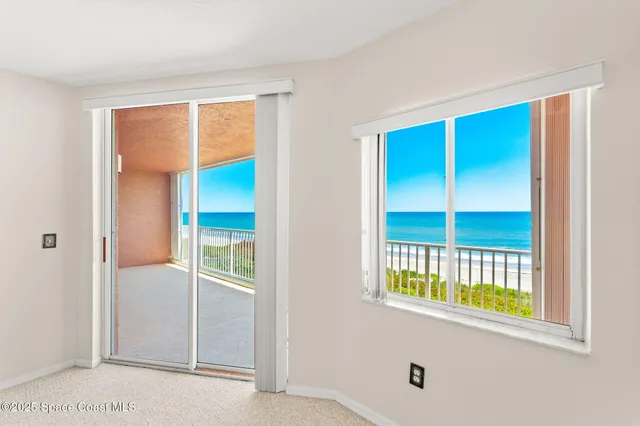 a kitchen with stainless steel appliances granite countertop a refrigerator a sink dishwasher a stove and white cabinets