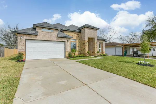 front view of a house with a yard
