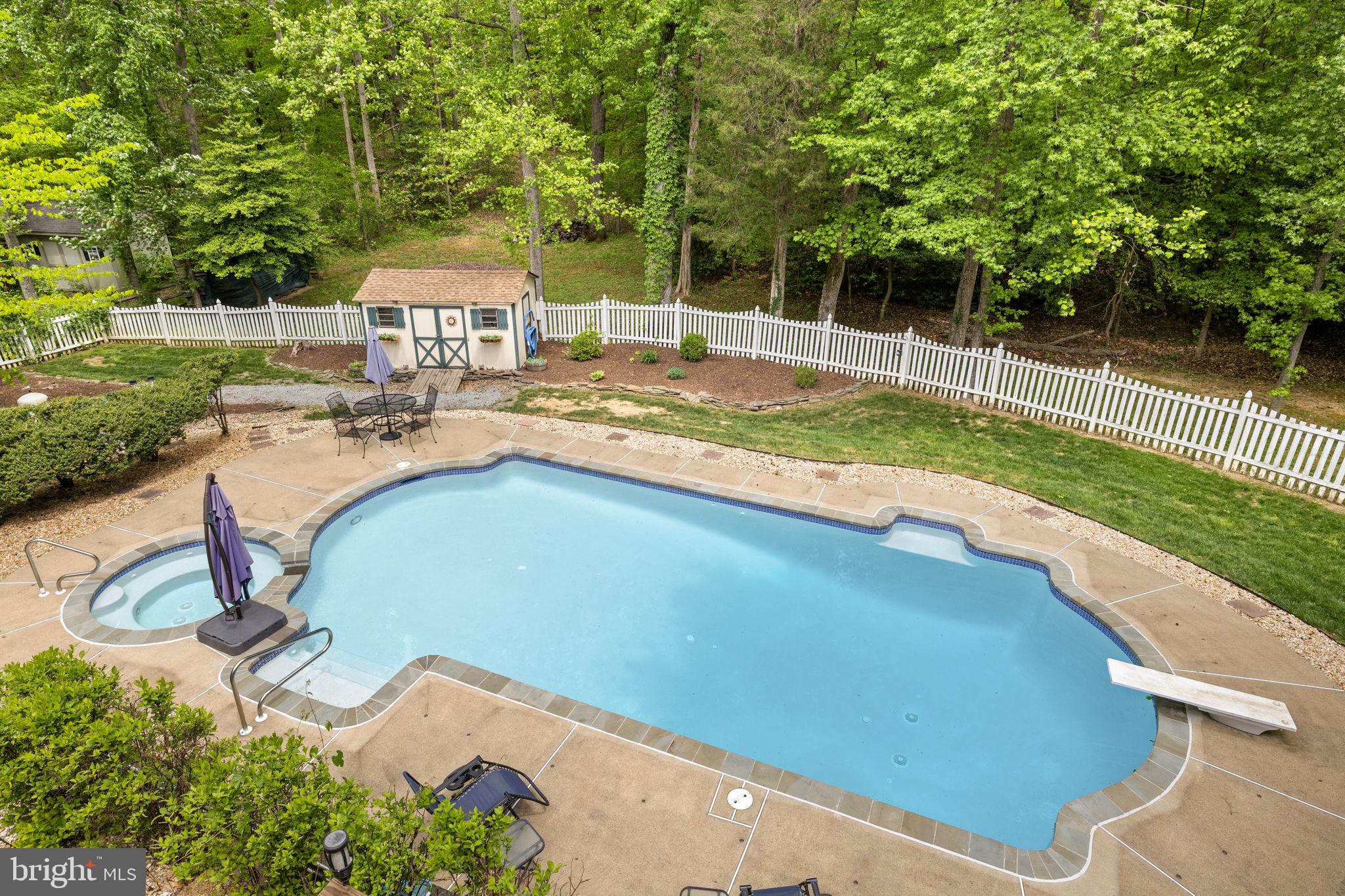 100 Boscobel Road Fredericksburg, VA 22405 - Photo 10 of 67 a view of a swimming pool with a patio and a yard