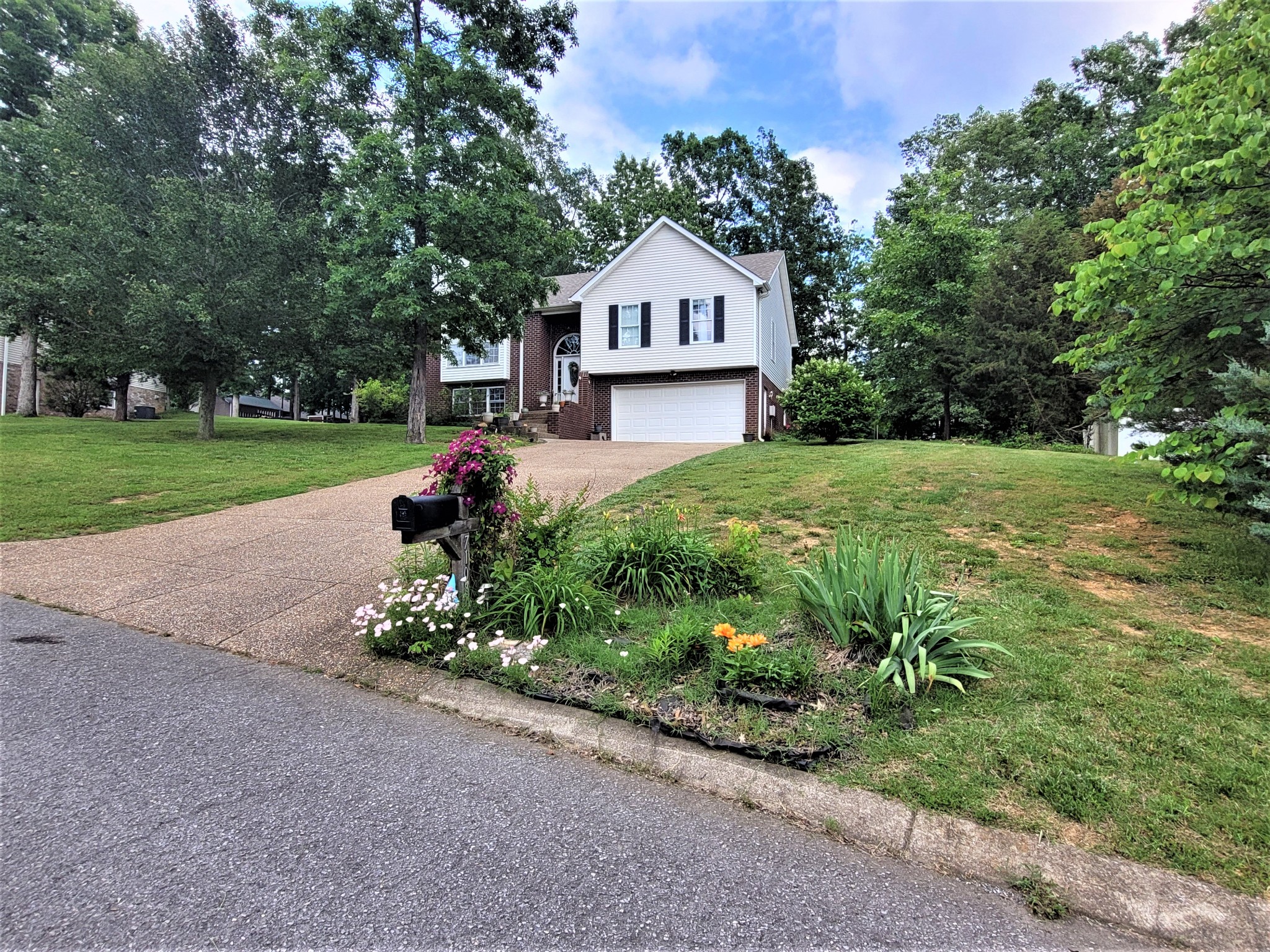 a house view with a garden space