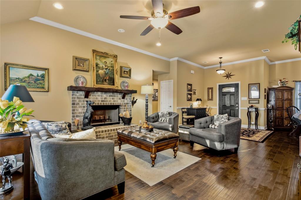 3911 Bennett Road Howe, TX 75459 - Photo 2 of 34 Comfortable living is just steps away as you enter the front door into a lovely living area featuring high ceilings and a fireplace.