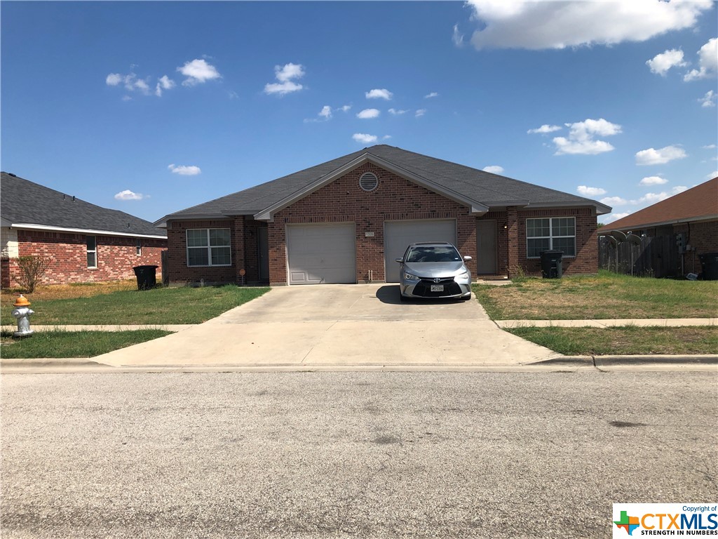 6208 Temora Loop, Unit A & B Killeen, TX 76549 - Photo 1 of 1 a swimming pool with a yard and glass top table and chairs