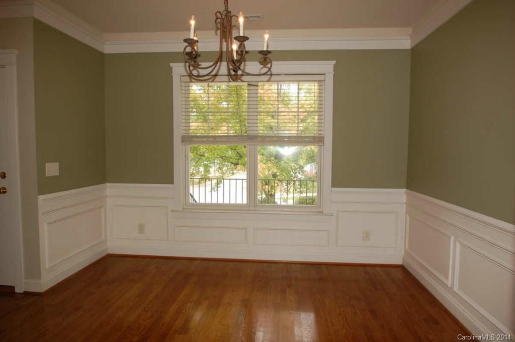 8202 Townley Road Huntersville, NC 28078 - Photo 8 of 24 an empty room with wooden floor and windows