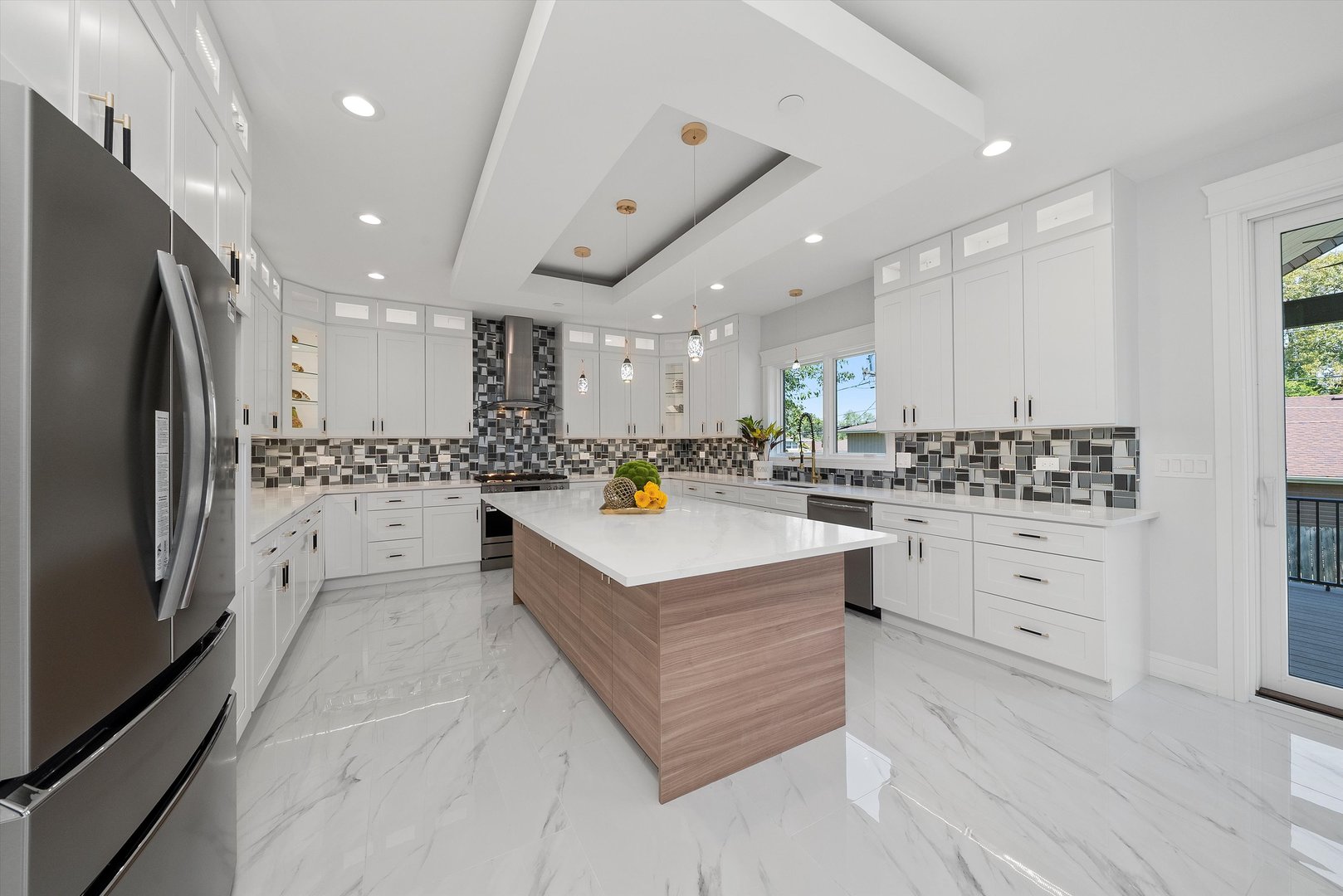 10441 South 83rd Avenue Palos Hills, IL 60465 - Photo 12 of 47 a kitchen with white cabinets and stainless steel appliances