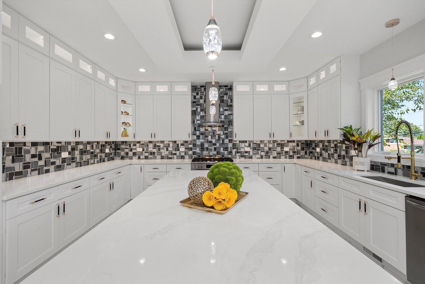 10441 South 83rd Avenue Palos Hills, IL 60465 - Photo 15 of 47 a large white kitchen with lots of counter space and chandelier