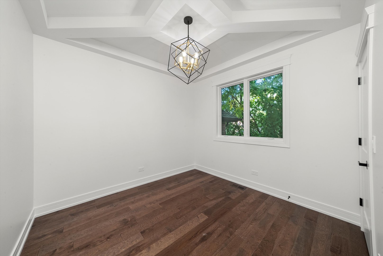 10441 South 83rd Avenue Palos Hills, IL 60465 - Photo 19 of 47 an empty room with wooden floor fan and windows