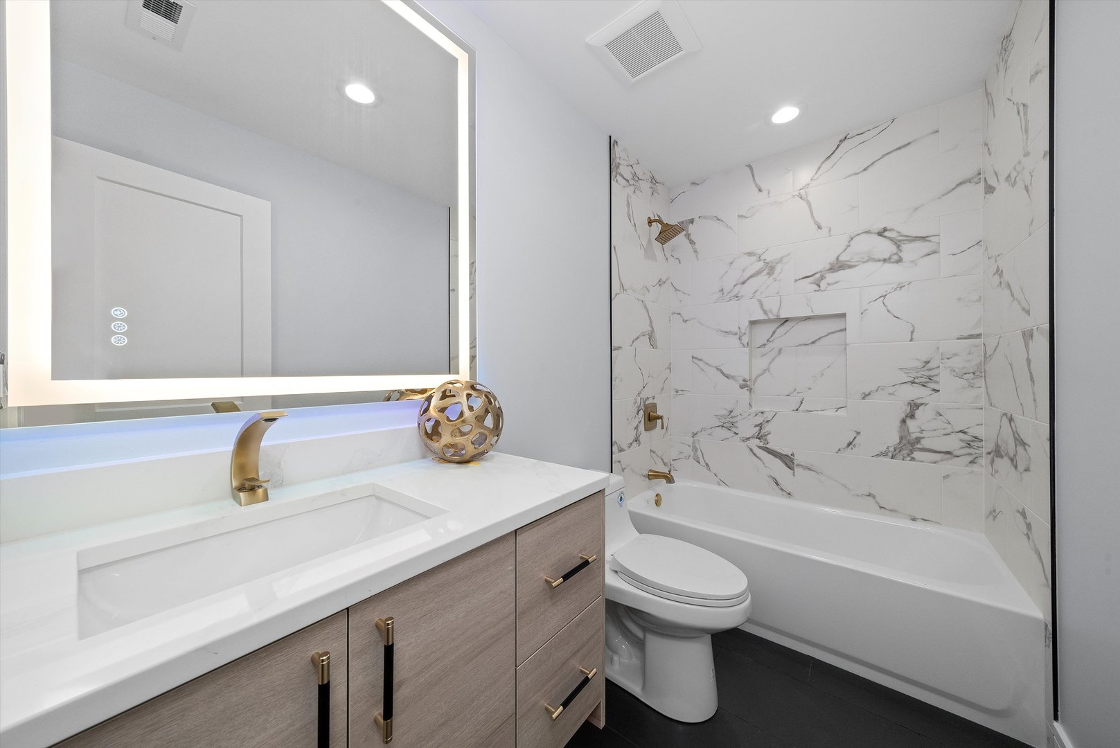 10441 South 83rd Avenue Palos Hills, IL 60465 - Photo 22 of 47 a bathroom with a sink a toilet and shower