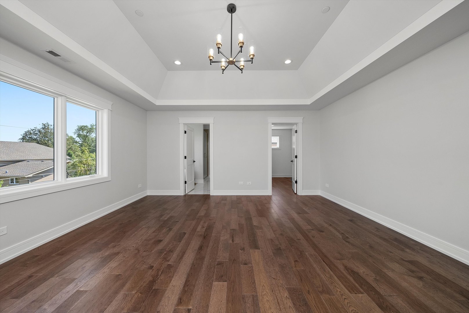 10441 South 83rd Avenue Palos Hills, IL 60465 - Photo 25 of 47 a view of an empty room with wooden floor and a window