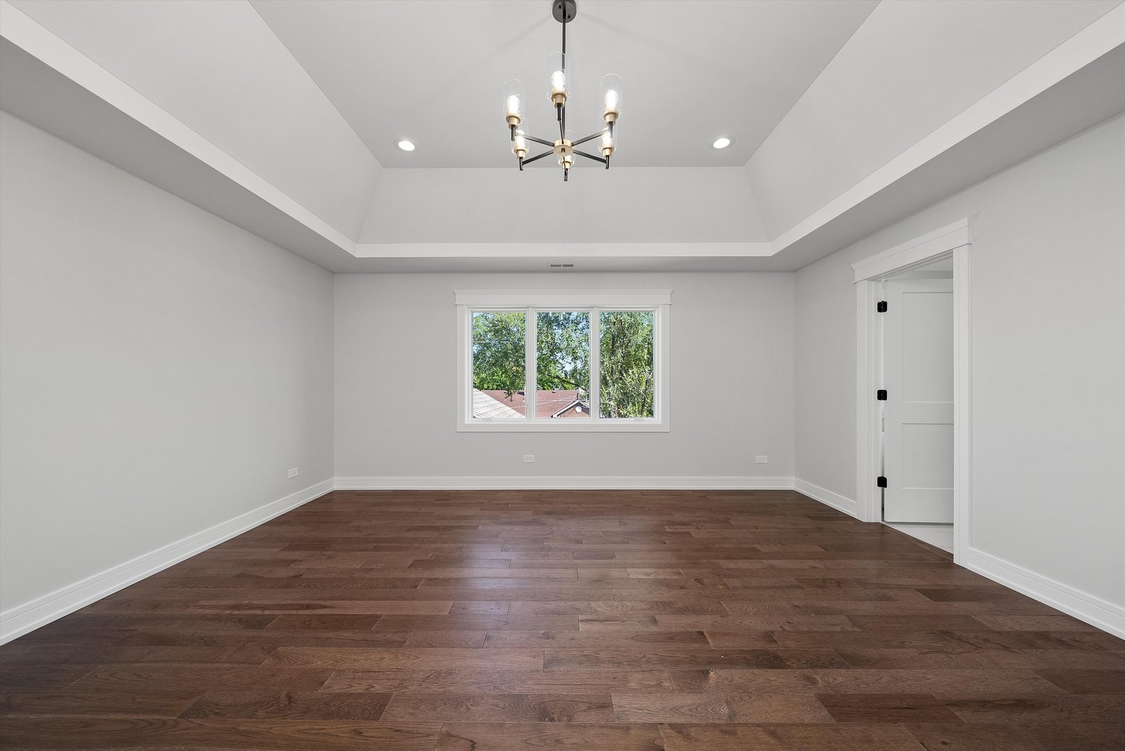 10441 South 83rd Avenue Palos Hills, IL 60465 - Photo 26 of 47 a view of an empty room with wooden floor and a window
