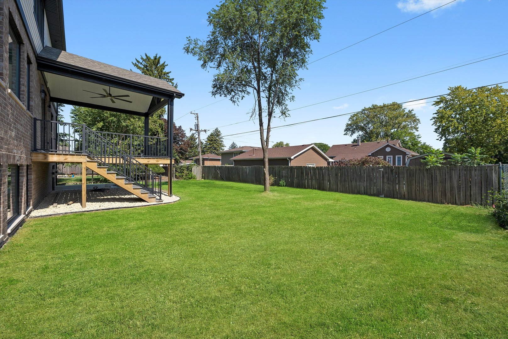 10441 South 83rd Avenue Palos Hills, IL 60465 - Photo 40 of 47 a view of a backyard with table and chairs and a slide