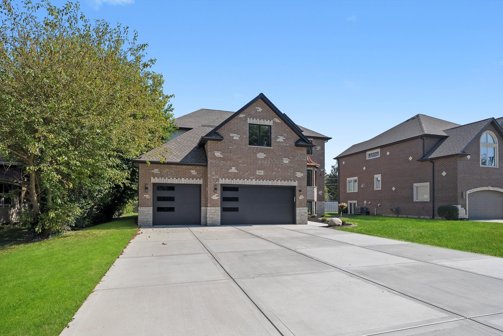 10441 South 83rd Avenue Palos Hills, IL 60465 - Photo 42 of 47 a front view of a house with a yard and a garage