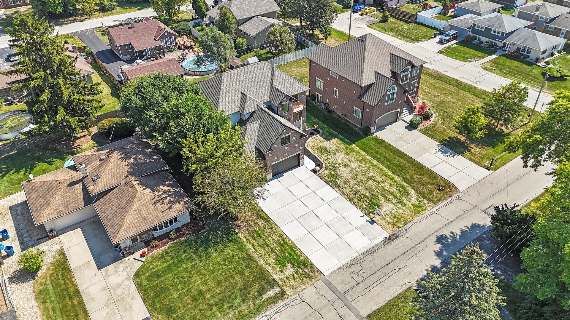10441 South 83rd Avenue Palos Hills, IL 60465 - Photo 46 of 47 an aerial view of a house with a yard