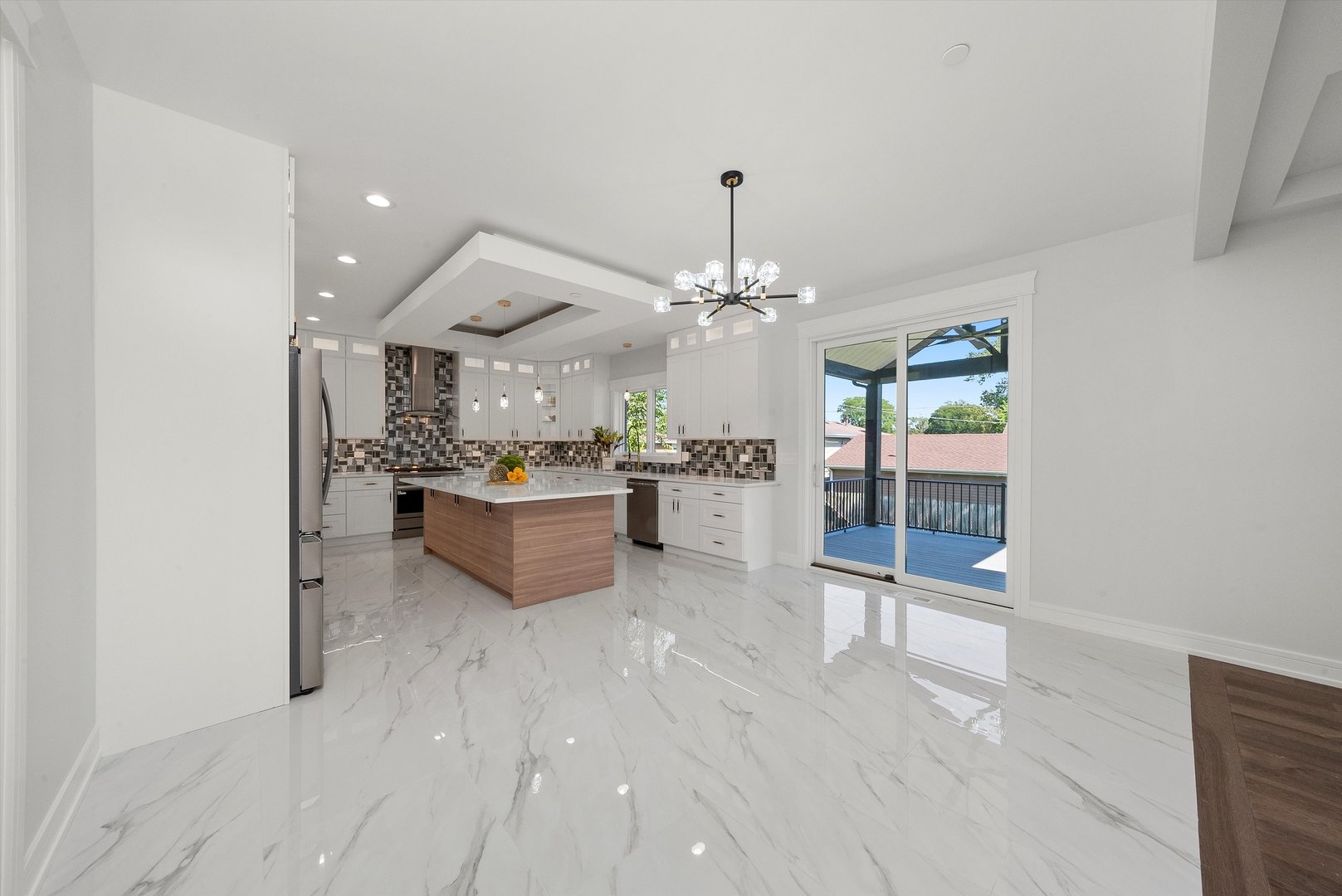 10441 South 83rd Avenue Palos Hills, IL 60465 - Photo 8 of 47 a living room with furniture and a chandelier