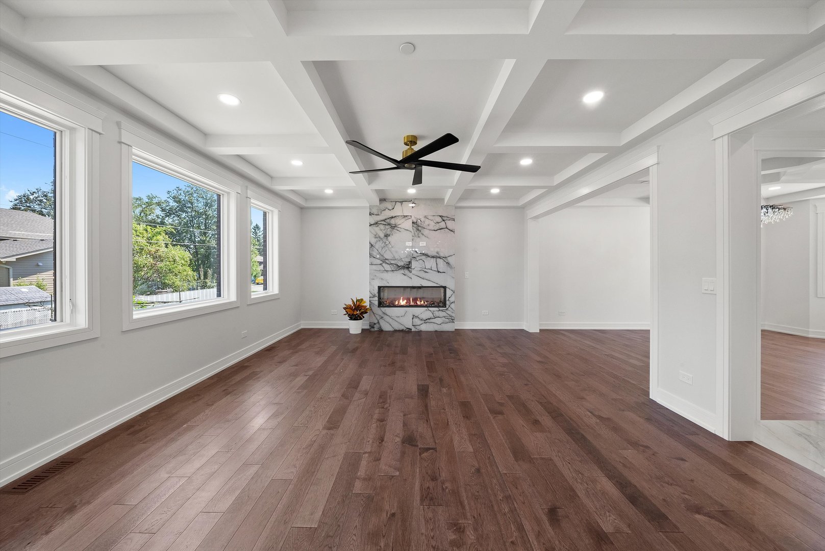 10441 South 83rd Avenue Palos Hills, IL 60465 - Photo 10 of 47 a view of a livingroom with a hardwood floor and a ceiling fan
