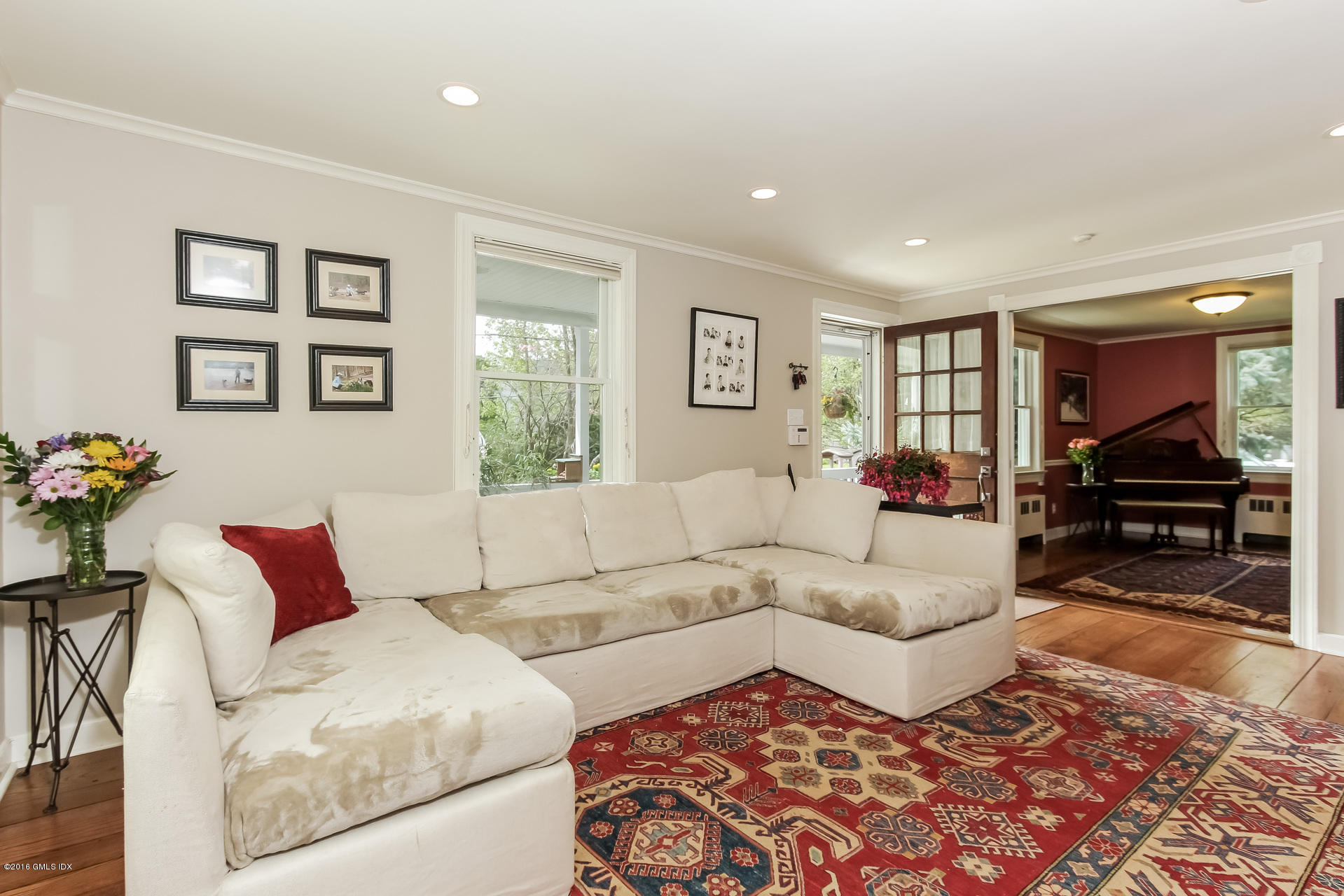 3 Idlewild Manor Greenwich, CT 06830 - Photo 12 of 26 a living room with furniture and a couch