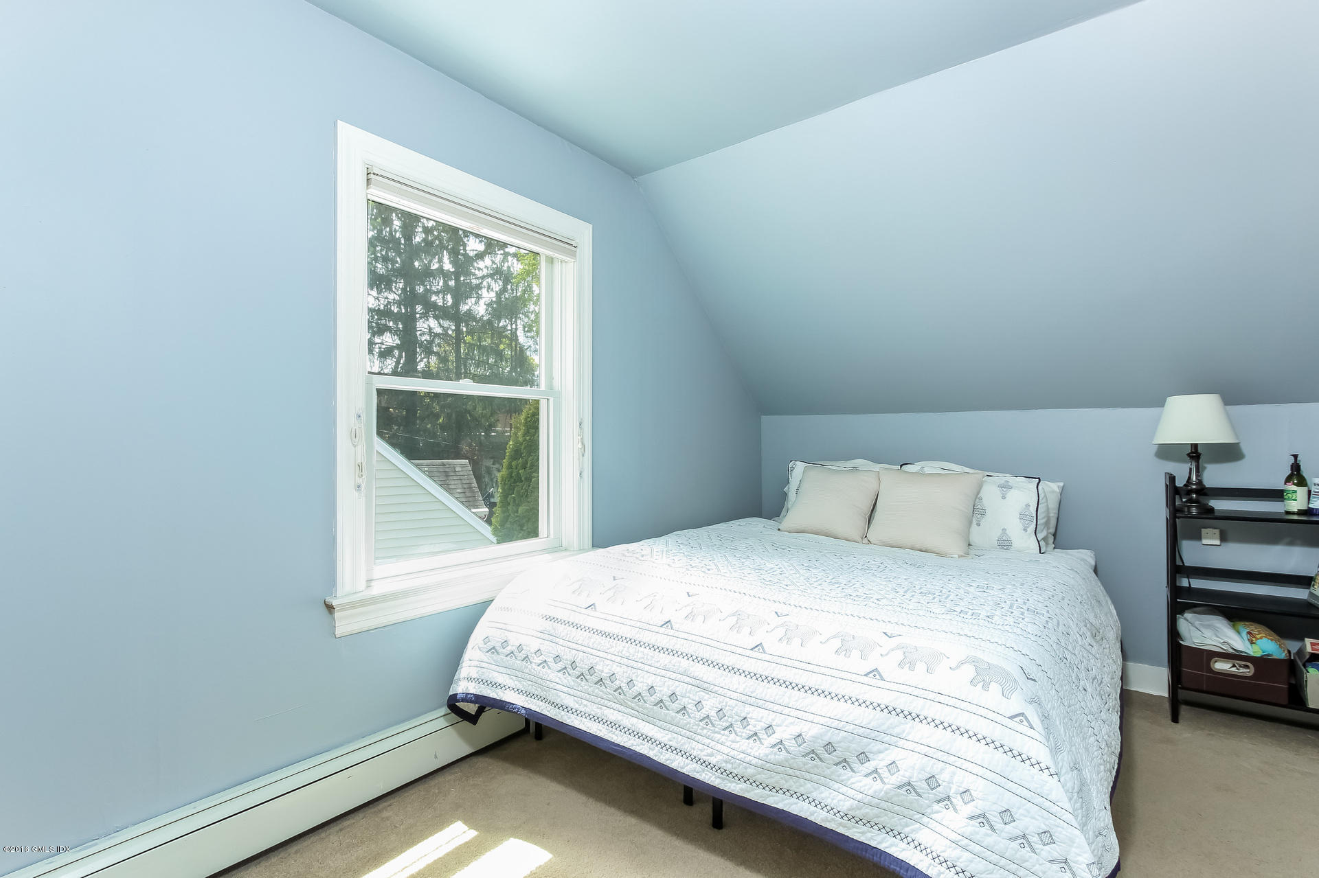 3 Idlewild Manor Greenwich, CT 06830 - Photo 15 of 26 a bedroom with a bed and a window