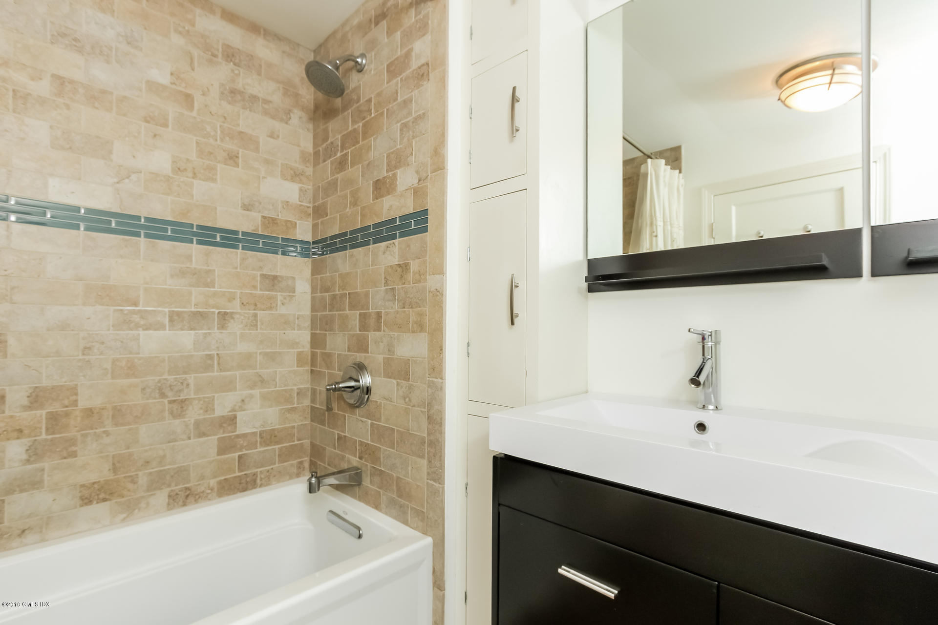 3 Idlewild Manor Greenwich, CT 06830 - Photo 16 of 26 a bathroom with a bathtub and a sink