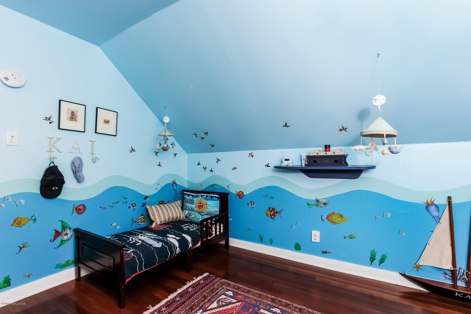 3 Idlewild Manor Greenwich, CT 06830 - Photo 17 of 26 a bedroom with furniture and a wooden floor