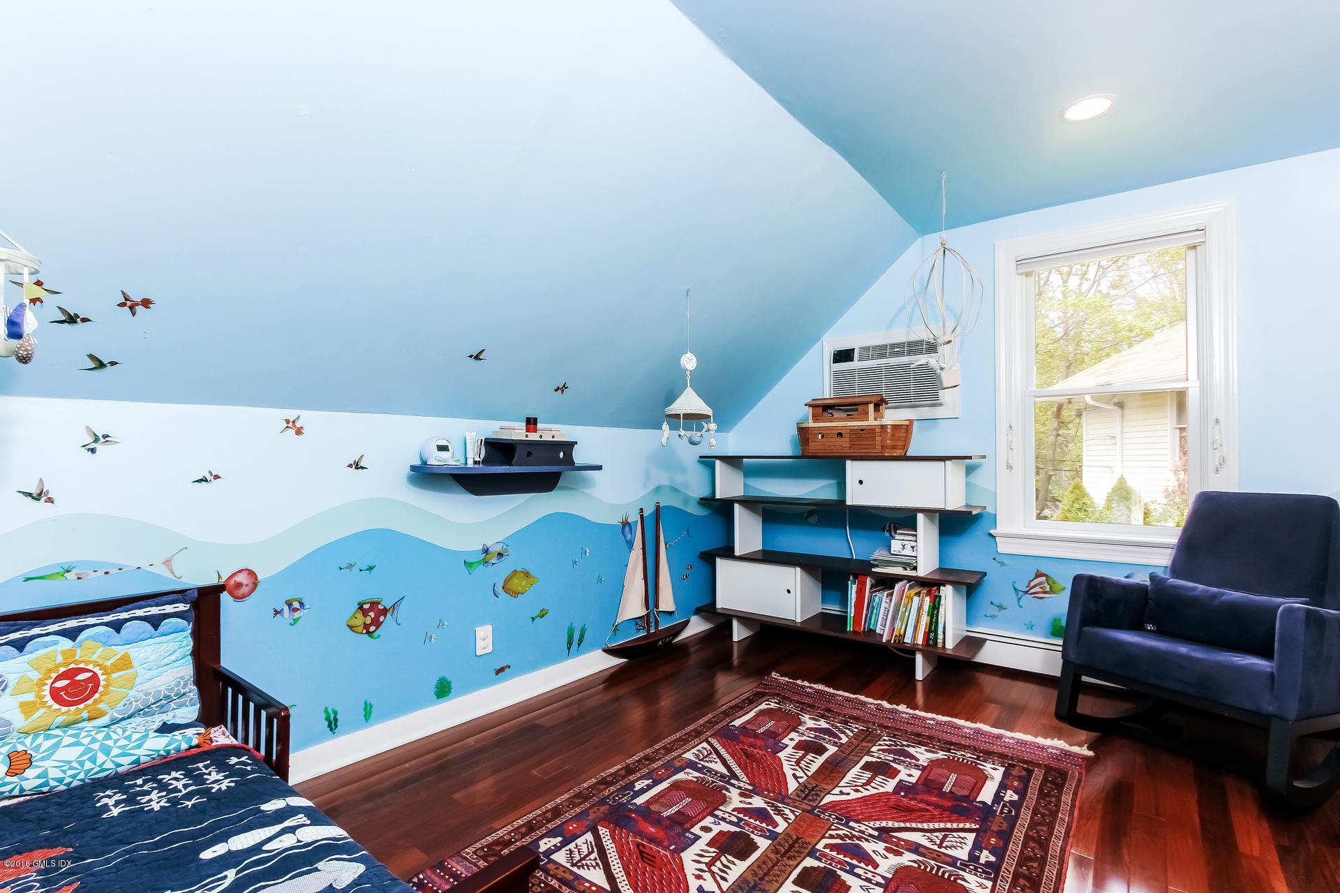 3 Idlewild Manor Greenwich, CT 06830 - Photo 18 of 26 a room with furniture and a book shelf