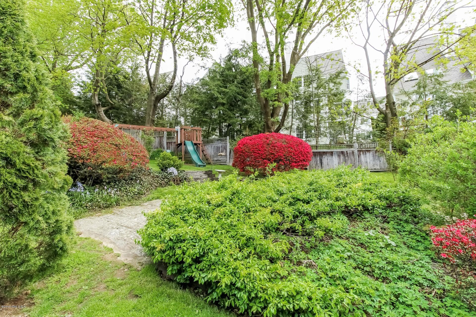 3 Idlewild Manor Greenwich, CT 06830 - Photo 19 of 26 a view of a garden with a fountain